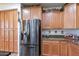 Kitchen features stainless steel appliances and wood cabinets at 42608 N 46Th Ave, New River, AZ 85087