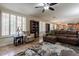 Bright living room with large windows and built-in shelving at 42608 N 46Th Ave, New River, AZ 85087