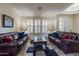 Living room with leather sofas and a coffee table at 42608 N 46Th Ave, New River, AZ 85087