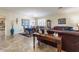 Living and dining area with leather furniture and tile floors at 42608 N 46Th Ave, New River, AZ 85087