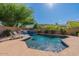 Stunning pool with a waterfall feature and plenty of space for relaxation at 42608 N 46Th Ave, New River, AZ 85087