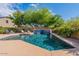 Relaxing pool area with water feature and comfortable lounge chairs at 42608 N 46Th Ave, New River, AZ 85087