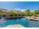 Enjoy this refreshing pool with a waterfall and spacious deck at 42608 N 46Th Ave, New River, AZ 85087