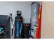 Utility room with water softener and water heater at 42608 N 46Th Ave, New River, AZ 85087