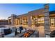 A stunning backyard featuring a pool, fire pit, and seamless indoor-outdoor living with travertine floors at 36323 N 100Th Way, Scottsdale, AZ 85262