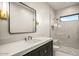 Modern bathroom featuring elegant glass enclosed shower, marble countertop and tile flooring at 36323 N 100Th Way, Scottsdale, AZ 85262