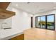 Bright bedroom with a sliding glass door leading to a balcony overlooking mountain views, with modern ceiling fan at 36323 N 100Th Way, Scottsdale, AZ 85262