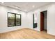 Bright bedroom featuring hardwood floors, recessed lighting, and view to the outside at 36323 N 100Th Way, Scottsdale, AZ 85262