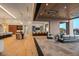 Open concept great room with bar and kitchen access and a seamless transition to the back patio at 36323 N 100Th Way, Scottsdale, AZ 85262