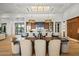 Spacious kitchen features an island with bar seating and designer pendant lighting at 36323 N 100Th Way, Scottsdale, AZ 85262
