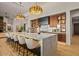 Gourmet kitchen with an expansive island, modern lighting, stainless steel appliances, and stylish seating at 36323 N 100Th Way, Scottsdale, AZ 85262