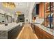 Open kitchen featuring custom cabinets, a spacious island, modern lighting, and a seamless flow to the living area at 36323 N 100Th Way, Scottsdale, AZ 85262