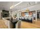 Bright, open-concept kitchen with a large island, modern lighting, and wood floors at 36323 N 100Th Way, Scottsdale, AZ 85262
