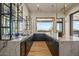 Open kitchen bar with stone countertops, sleek cabinetry, and bright natural light at 36323 N 100Th Way, Scottsdale, AZ 85262