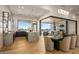 Modern kitchen area with stone countertops, sleek cabinetry, and indoor/outdoor access at 36323 N 100Th Way, Scottsdale, AZ 85262