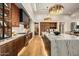 Gourmet kitchen boasting a large island, custom cabinetry, modern appliances, and hardwood flooring at 36323 N 100Th Way, Scottsdale, AZ 85262