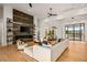 Spacious living room featuring hardwood floors, a fireplace, comfortable seating and an open layout perfect for entertaining at 36323 N 100Th Way, Scottsdale, AZ 85262