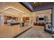 Expansive open-plan living space with multiple seating areas, two bar areas, and gourmet kitchen at 36323 N 100Th Way, Scottsdale, AZ 85262