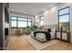 Bright and airy main bedroom with large windows, a fireplace, and comfortable seating at 36323 N 100Th Way, Scottsdale, AZ 85262