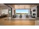 Seamless indoor-outdoor living with sliding glass doors leading to a patio with fireplace and scenic desert views at 36323 N 100Th Way, Scottsdale, AZ 85262