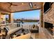 Relaxing outdoor living space with a fireplace, TV, pool, and scenic views at 36323 N 100Th Way, Scottsdale, AZ 85262