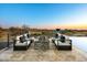 Outdoor fire pit with luxurious outdoor seating to create a relaxing entertainment space at 36323 N 100Th Way, Scottsdale, AZ 85262