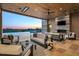 Inviting covered patio with outdoor furniture, fireplace, swimming pool, and distant mountain views at 36323 N 100Th Way, Scottsdale, AZ 85262