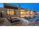 Resort-style backyard with pool, lounge chairs, and covered patio, perfect for enjoying the outdoors at 36323 N 100Th Way, Scottsdale, AZ 85262