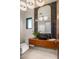 Stylish powder room featuring modern floating vanity, tile flooring and lighting at 36323 N 100Th Way, Scottsdale, AZ 85262