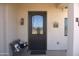 Inviting entryway with decorative glass front door, bench, and stucco exterior at 1527 E Germann Rd, San Tan Valley, AZ 85140