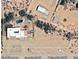 Aerial view of a large house with a pool and surrounding desert landscape at 20102 W Camelback Rd, Litchfield Park, AZ 85340