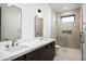 Spa-like bathroom with double vanity and glass shower at 28805 N 114Th St, Scottsdale, AZ 85262