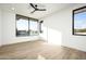 Light and airy bedroom with hardwood floors and expansive windows at 28805 N 114Th St, Scottsdale, AZ 85262