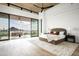 Main bedroom with sliding glass doors opening to a patio and mountain views at 28805 N 114Th St, Scottsdale, AZ 85262