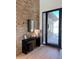 Elegant entryway with stone wall and modern console table at 28805 N 114Th St, Scottsdale, AZ 85262