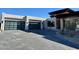 Three-car garage with modern glass doors at 28805 N 114Th St, Scottsdale, AZ 85262