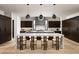 Modern kitchen with marble countertops and dark wood cabinets at 28805 N 114Th St, Scottsdale, AZ 85262