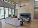 Light-filled living room with stone fireplace and hardwood floors at 28805 N 114Th St, Scottsdale, AZ 85262