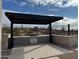 Covered outdoor kitchen with built-in grill and stone countertops at 28805 N 114Th St, Scottsdale, AZ 85262