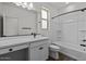 Bright bathroom featuring a vanity with sink and tub shower combo at 18180 W Pima St, Goodyear, AZ 85338