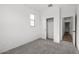 Neutral-toned bedroom with carpeted floors and a closet at 18180 W Pima St, Goodyear, AZ 85338