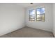 Bright bedroom featuring two windows, offering plenty of natural light at 18186 W Pima St, Goodyear, AZ 85338