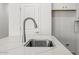 Close-up of the kitchen island sink with a stainless steel faucet and countertop at 18186 W Pima St, Goodyear, AZ 85338