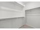 Bright walk-in closet with shelving for organized storage at 18186 W Pima St, Goodyear, AZ 85338