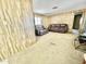 Living room with leather couches and wood paneling at 318 S Crismon Rd # 82, Mesa, AZ 85208