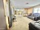 Spacious living area with leather furniture and large windows at 318 S Crismon Rd # 82, Mesa, AZ 85208