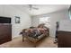 Cozy bedroom featuring a comfortable bed, natural light, and a functional workspace at 244 N Hawes Rd, Mesa, AZ 85207