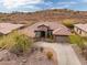 Attractive single-story home with Southwestern architecture, low maintenance desert landscaping, and tile roof at 41618 N Anthem Ridge Dr, Phoenix, AZ 85086