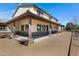 Inviting two-story home showcasing a spacious covered patio with stone pillars and ample outdoor area at 4880 E Beehive Rd, San Tan Valley, AZ 85140