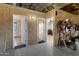 View of the garage area with multiple doorways leading to additional rooms, and a sign on the wall at 4880 E Beehive Rd, San Tan Valley, AZ 85140